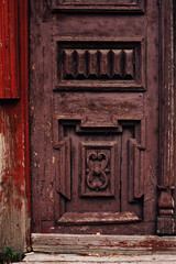 antique wooden carved burgundy doors