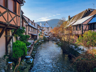 River view in Kaysersberg-Vignoble - colorful half-timbered houses in snow, village near Colmar,...