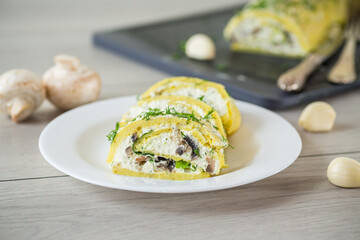 baked potato roll with cottage cheese filling with garlic and mushrooms, on a light wooden table