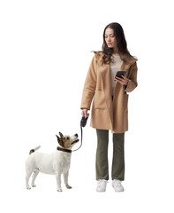 Pet owner walking the dog and checking the smartphone