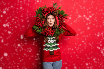 Photo of cool young lady look door decoration wear holiday sweater isolated on red color background