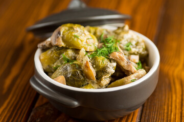 Brussel sprouts stewed in sour cream sauce with mushrooms and spices