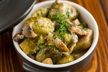 Brussel sprouts stewed in sour cream sauce with mushrooms and spices