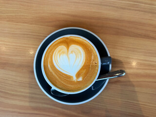 hot milk tea local traditional coffee kopi cappuccino mocha expresso latte in small blue cup on wood table hot beverage menu for cafe restaurant kopitiam