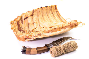 Piece of smoked pork ribs isolated on white background. meat. food concept. snacks. Knife
