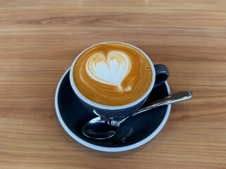 hot milk tea local traditional coffee kopi cappuccino mocha expresso latte in small blue cup on wood table hot beverage menu for cafe restaurant kopitiam