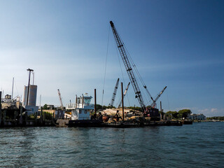 wood logs on pier in greenport harbor port long island new york