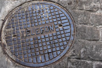 Round steel sewer manhole close-up