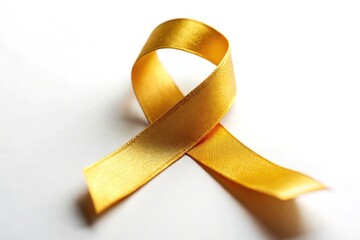 Gold Ribbon Childhood Cancer Awareness Symbol Isolated on White Background for Awareness Campaigns and Fundraising Efforts