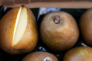 Sale of Bere Bosk pears on the market. Close-up