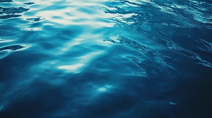 Naklejka premium Serene Deep Blue Water with Gentle Reflections in Calm Background
