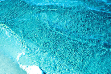 the water surface of a river or lake with sun glare at sunset