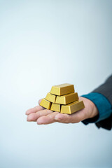 Gold bar stock photo, picture and photo on black table at night.