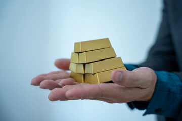 Gold bar stock photo, picture and photo on black table at night.