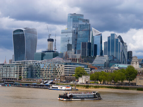 A stunning stock photo showcasing the iconic London skyline with the majestic Thames River flowing through the heart of the city. The photo captures the vibrancy and beauty of downtown London.