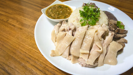 Hainanese Chicken Rice or Chicken Soup Rice - Asian Feet Style thaifood concept on
white background.  