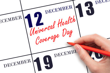 December 12. Hand writing text Universal Health Coverage Day on calendar date. Save the date.