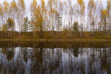 autumn landscape with river, road and clouds in the blue sky