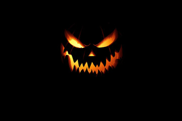 Naklejka premium Glowing Jack-o'-Lantern with Fangs