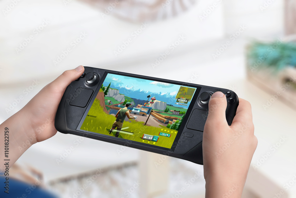 Poster child holding a handheld gaming console displaying an action game. living room background. showcasin
