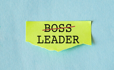 Office yellow note with handwritten text BOSS and change to LEADER, means different mindset and...