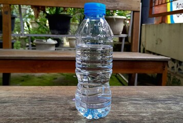 bottle of water on a wooden table