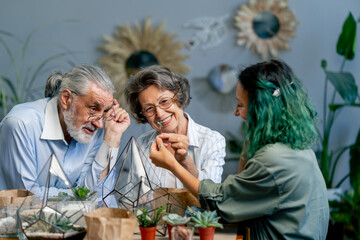 master class on creating compositions from plants for elderly people green-haired teacher happy old age elderly couple pleasant memories leisure time in old age