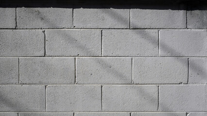 Cement Brick Wall with Shadows - Textured Background for Designers