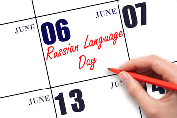 June 6. Hand writing text Russian Language Day on calendar date. Save the date.
