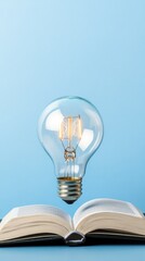 An open book shines under a bright bulb, symbolizing knowledge, creativity, and inspiration across diverse fields