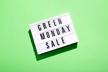 Green Monday Sale text in lightbox on green background flat lay, concept of sales and promotions