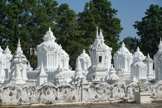 A cluster of white chedis, or Buddhist stupas, buddhist tomb, northern Thailand temple