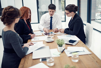 Teamwork, tablet and planning with business people in meeting for partnership, data analytics and company revenue. Client feedback, admin stats and mentor with employees in office for