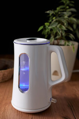 A beautiful kettle stands on the kitchen table