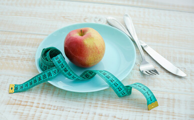 concept diet and weight loss on wooden background top view
