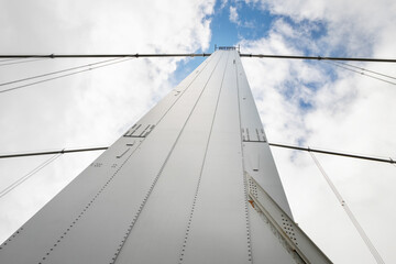 Obraz premium Detail of the Forth road bridge, showing the suspension cables and a support tower