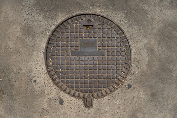Manhole cover with a unique hat-shaped design in Buenos Aires, perfect for VFX, urban scenes, or as a texture reference for 3D projects.