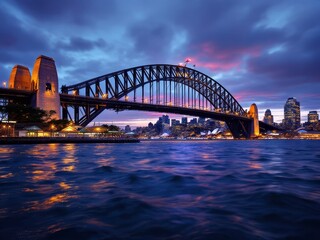 Obraz premium Sydney Harbour Bridge, illuminated at night, captured in stunning documentary photography.