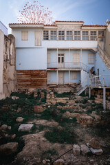 A house with ancient ruins in the yard