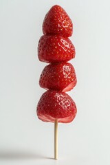 Strawberry coated with sugar, Tanghulu, isolated on white background	
