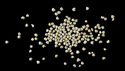 Puffed millet pile isolated on black, top view