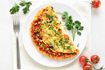 Stuffed omelette with red bell pepper and green onion