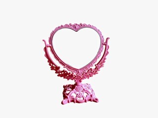 In the picture is a pink plastic mirror. It is a mirror used to look at the face. It looks like a heart with a beautiful pattern. It is all pink.
