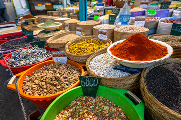 A spice stall at a traditional Arabic market in the medina of Sfax.