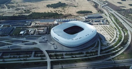 Munich, Germany - April 04, 2021: Drone flight over Football stadium Allianz Arena at sunny day
