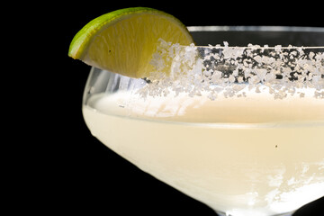 
Cocktail with salt on the glass and lime.