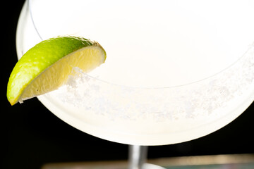
Cocktail with salt on the glass and lime.