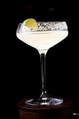 
Cocktail with salt on the glass and lime.