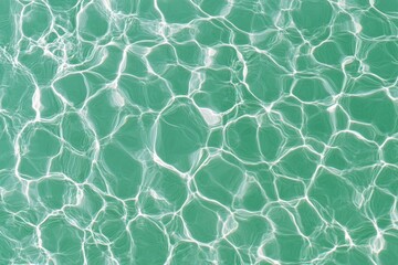 Obraz premium A serene aqua background featuring soft ripples of water with sunlight reflecting off the surface