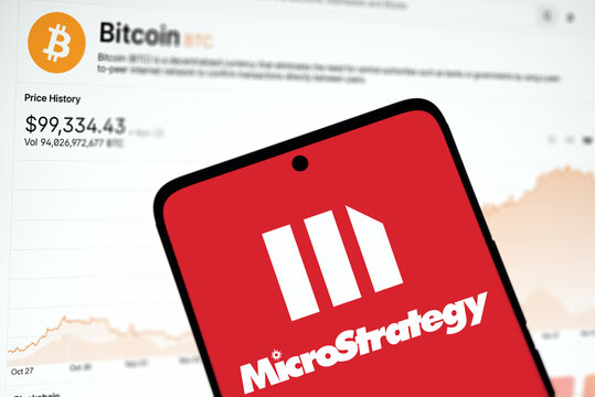 Dhaka, Bangladesh- 27 nov 2024: microstrategy logo is displayed on smartphone and Bitcoin price on the background.